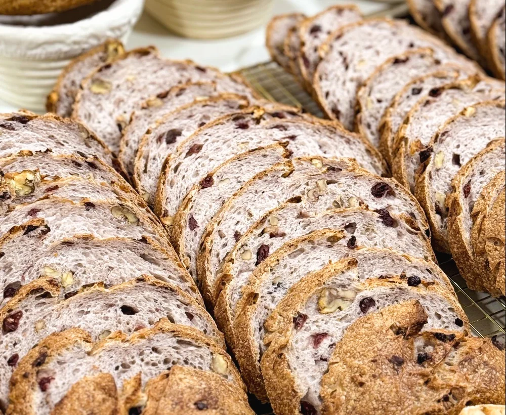 Sliced sourdough loaf with cranberries and nuts
